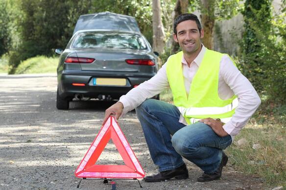 man holding a traffic sign